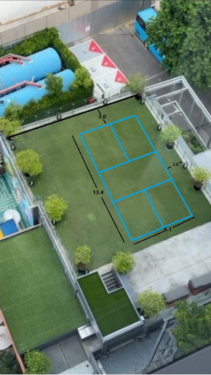 Aerial view of a rooftop with court dimensions marked: 13.4 m by 6.1 m plus run-off